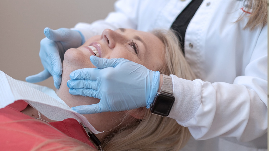 Pointing to the temporomandibular joint (TMJ) on a model school